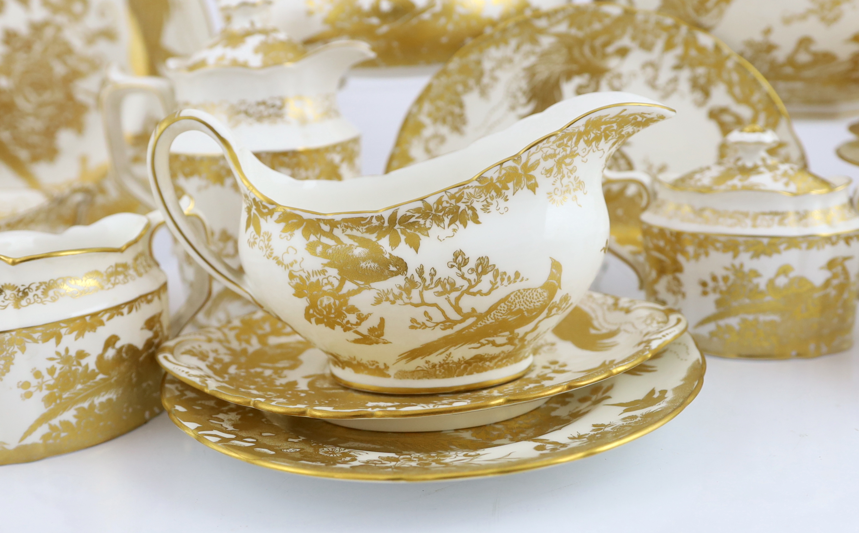 An extensive Royal Crown Derby Gold Aves dinner and tea service